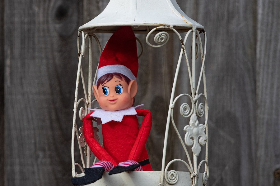 Elf on the Shelf Introduction Letters an Elf Sitting in a Small Lantern Shell