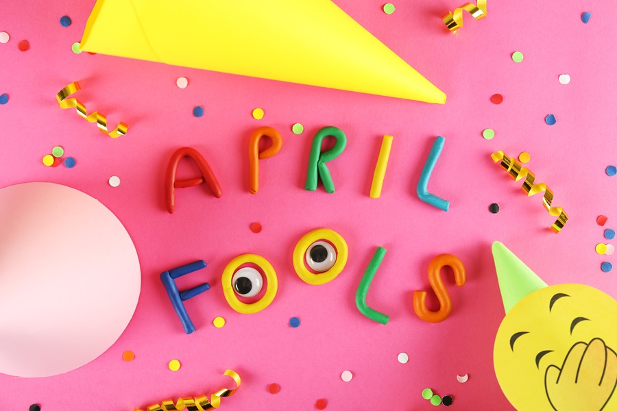 10 April Fools Jokes for Any Age a Pink Surface with April Fools Spelt Out in Clay with Sprinkles Scattered Around