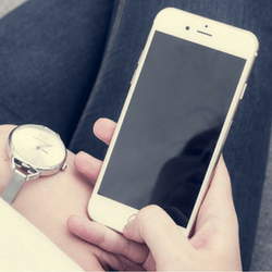 A person holding a phone, representing the idea of a mobile giving campaign for fundraising.