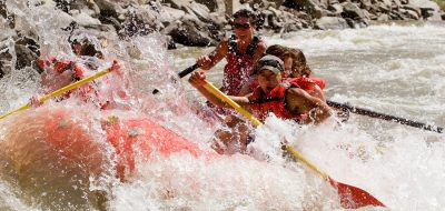 Rafters navigate the rapids in Glen Canyon, Colorado.