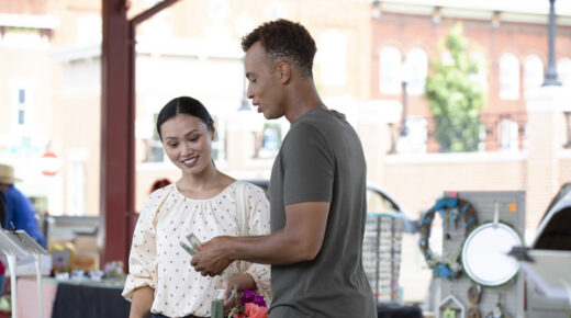 A couple getting ready to pay for groceries.