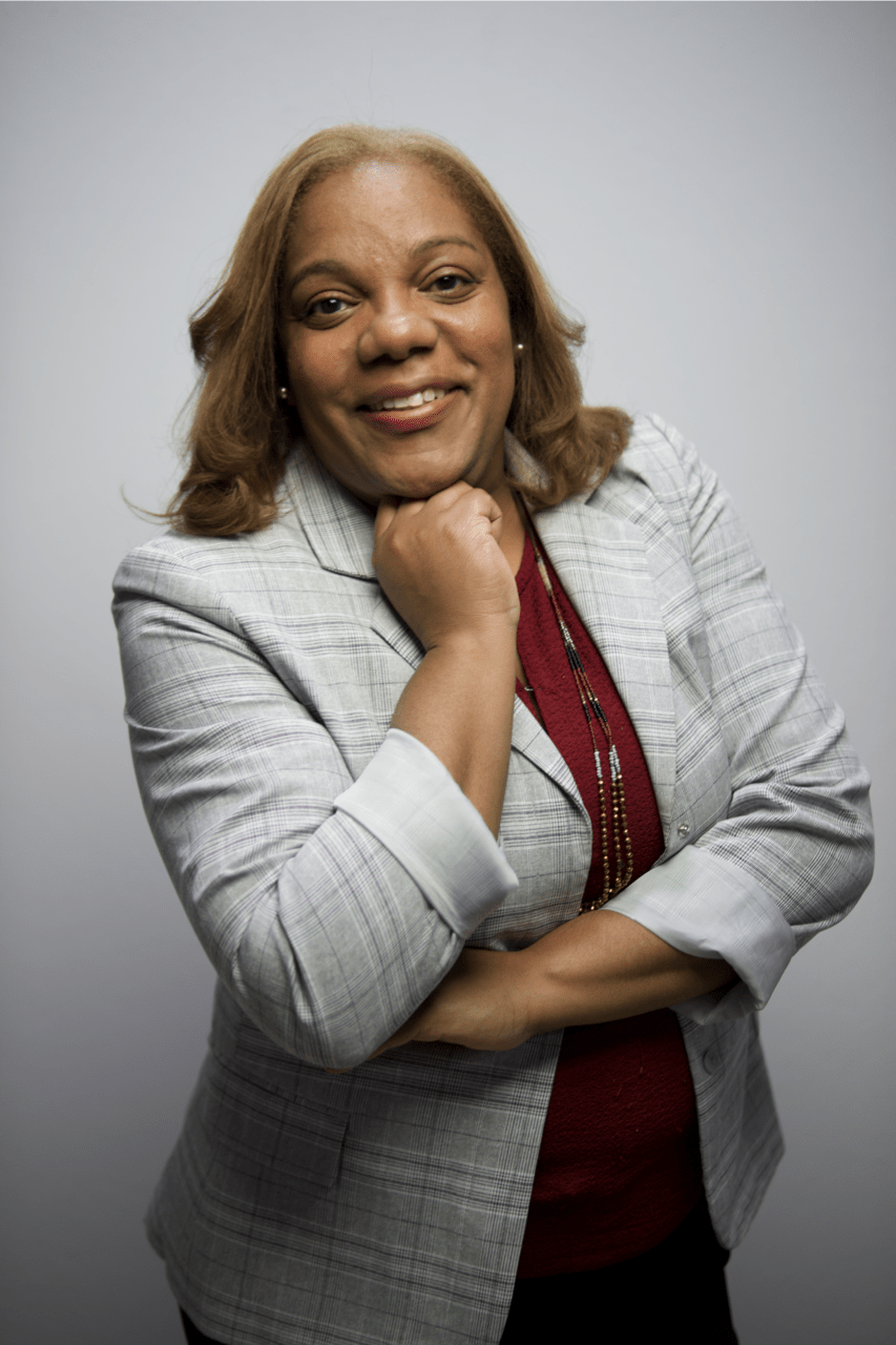 A headshot of a person wearing a suit jacket.