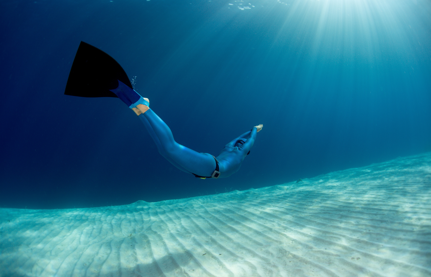 A freediver swimming underwater