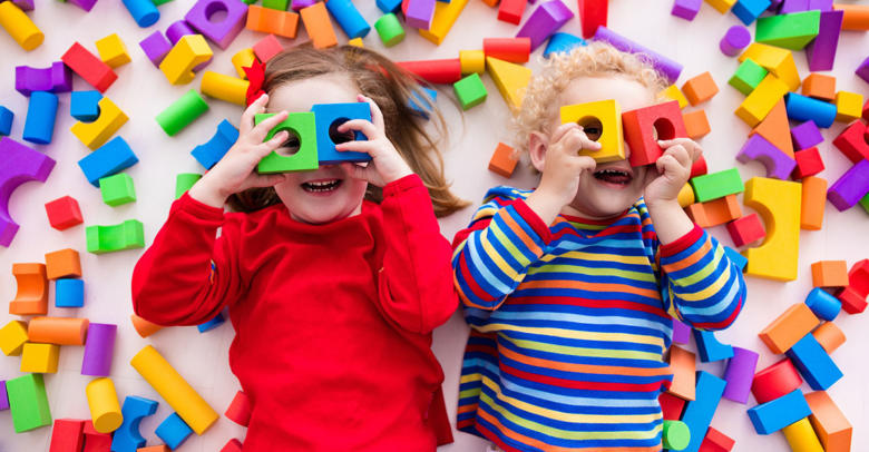 young children having fun with block play