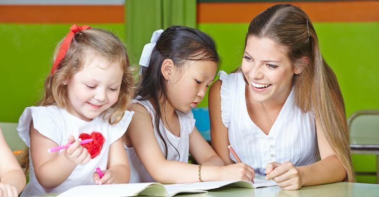 early childhood students learning from kindergarten teacher