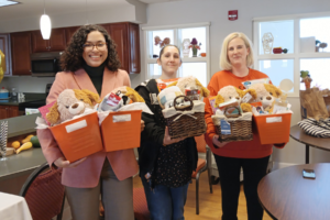 Students pose with gift baskets