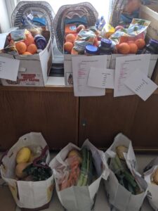 Bags of food are prepped on shelves for families at SUNY Morrisville