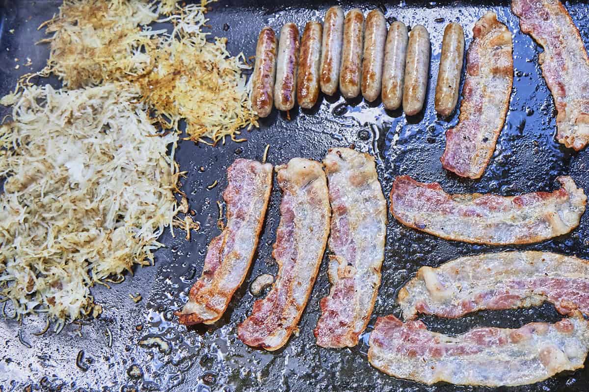 A griddle full of breakfast foods