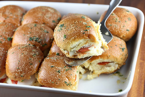 Prepared pizza sliders on tray.