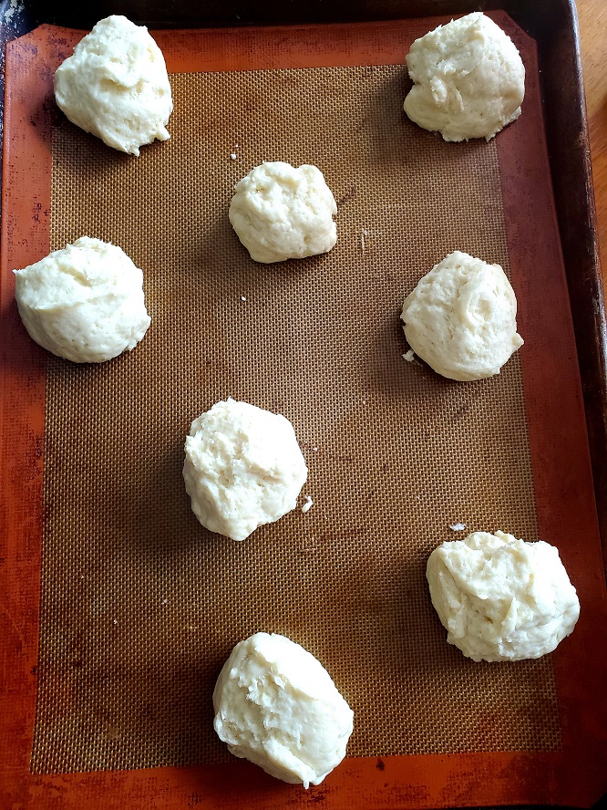 these are homemade shortcake biscuits on a silpat mat lined cookie sheet