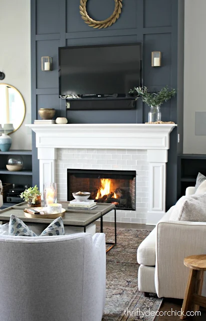 Dark blue fireplace with grid trim