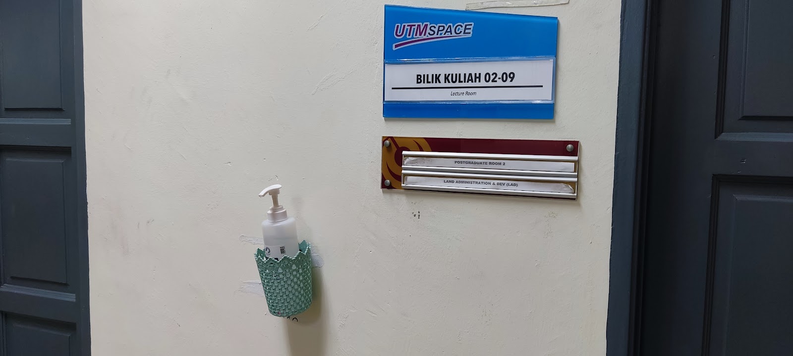 A hand sanitizer in front of BK02-09 room at T06 building in UTM.