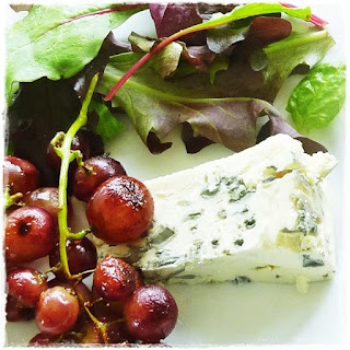 blue cheese with sauteed grapes