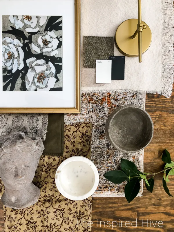 Modern traditional living room design flatlay with textures, brass, and floral art