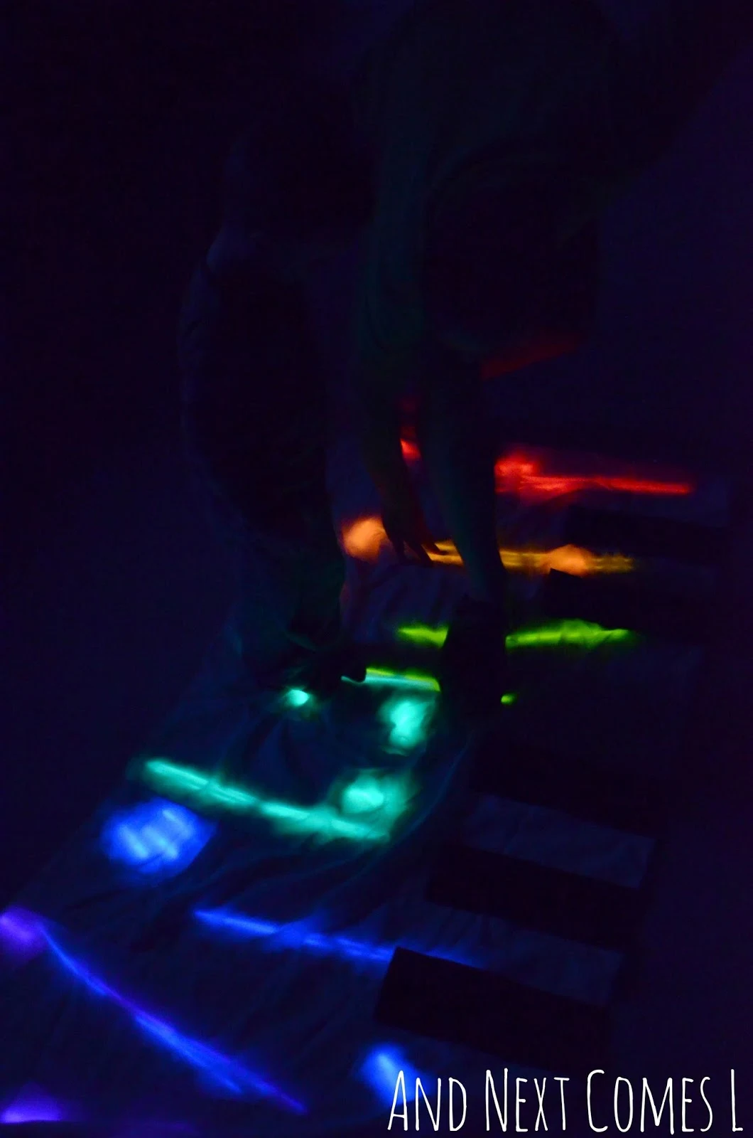 Playing twister on a homemade glowing floor piano from And Next Comes L