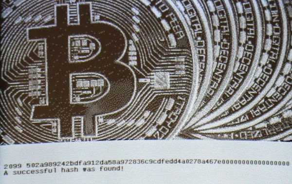 The algorithm found a successful hash, indicated by all the zeros at the end. Bitcoin graphic source probably MoneyWeek.