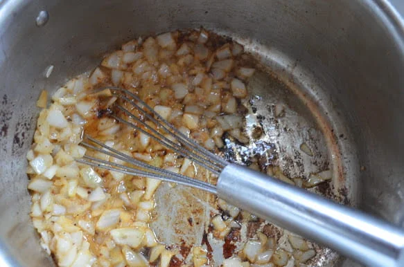 Sauté onions until caramelized for Loaded Baked Potato Soup. 