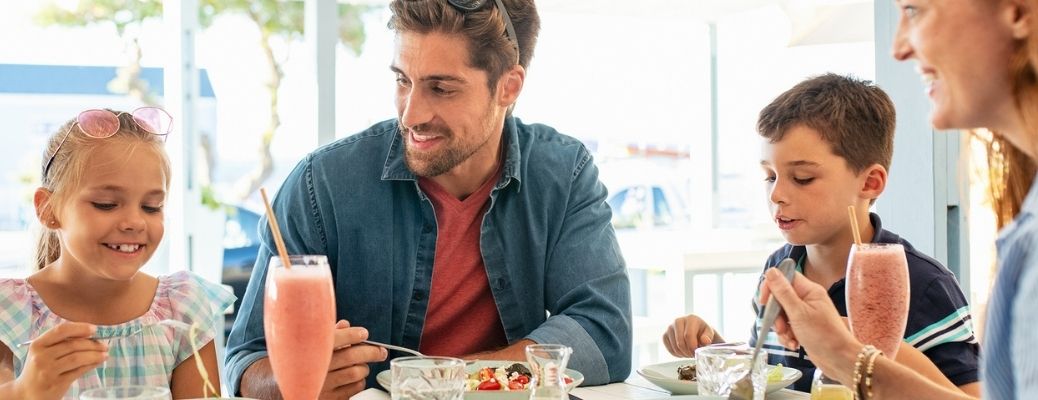 A family eating at a vegan restaurant