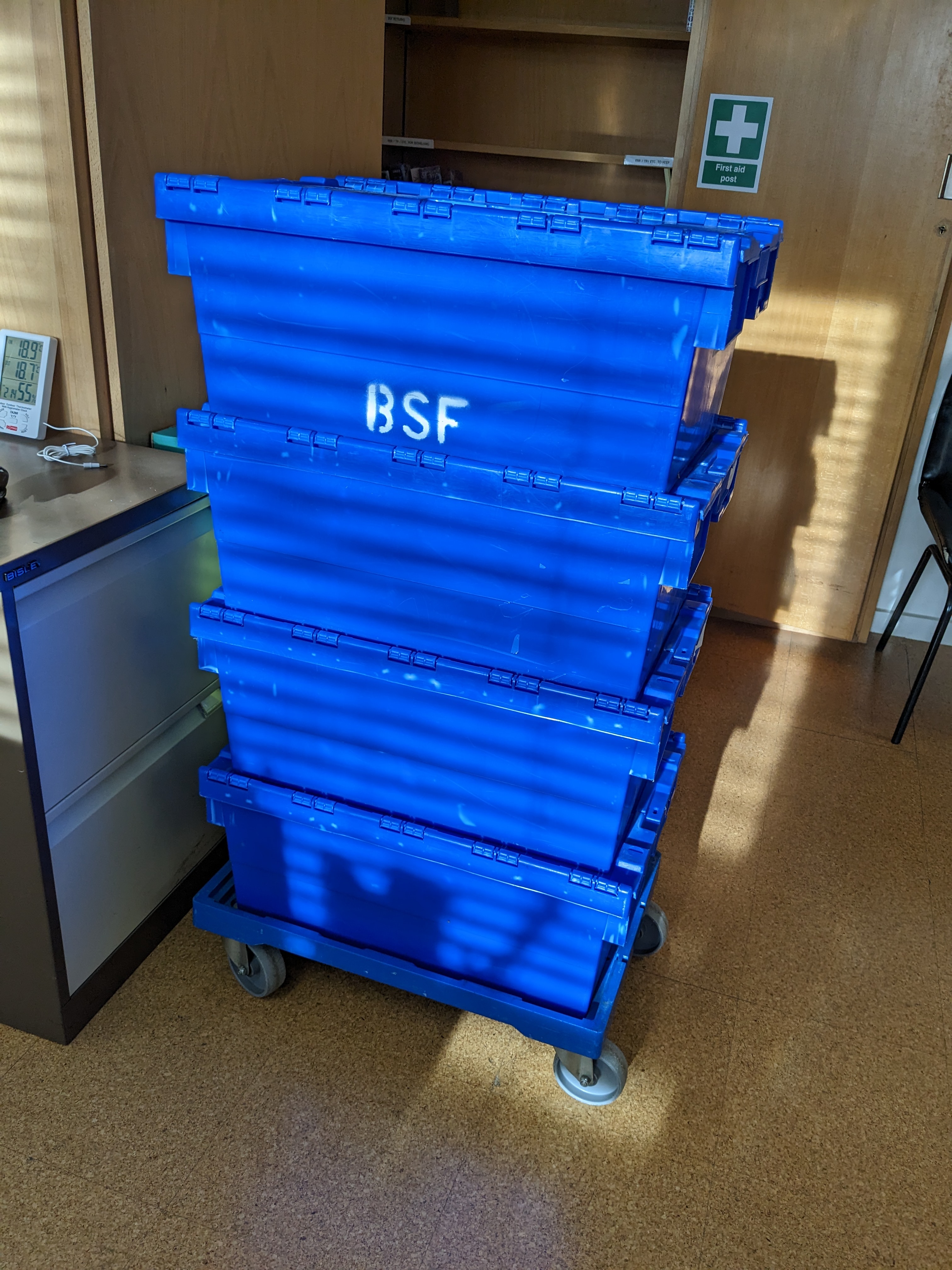 Four blue crates stacked on top of each other. 'BSF' is written in white on the side of the top box