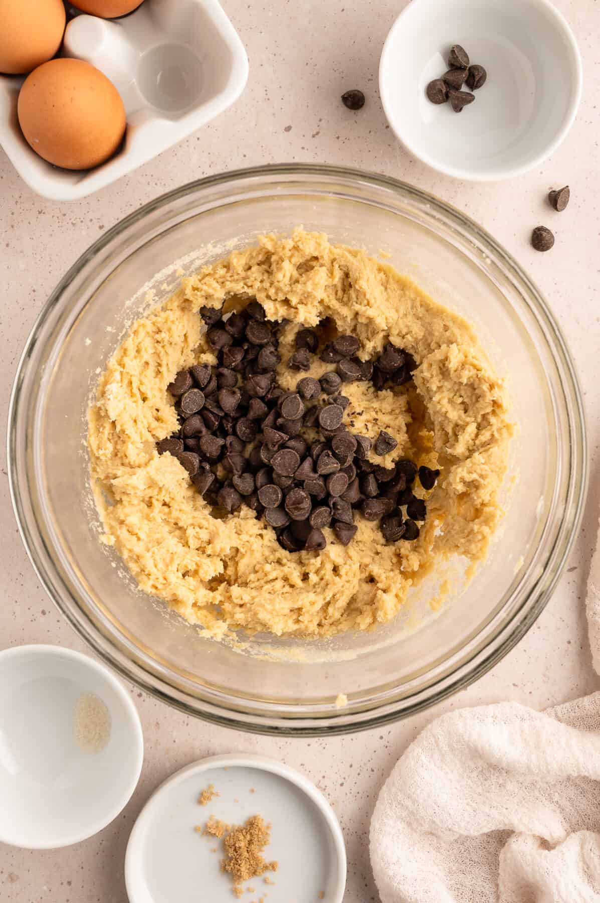 folding the chocolate chips into the cookie dough. 