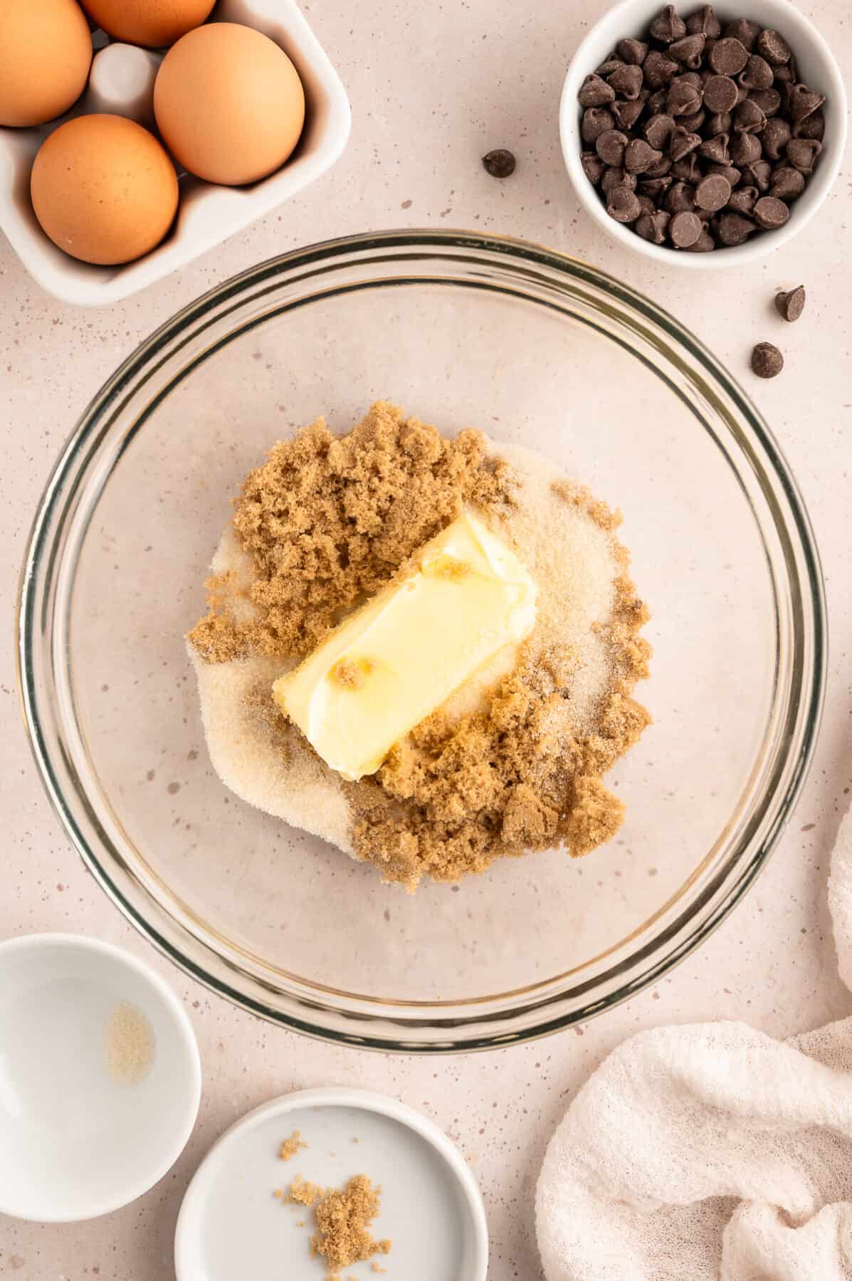 softened butter on top of sugar in a large mixing bowl.