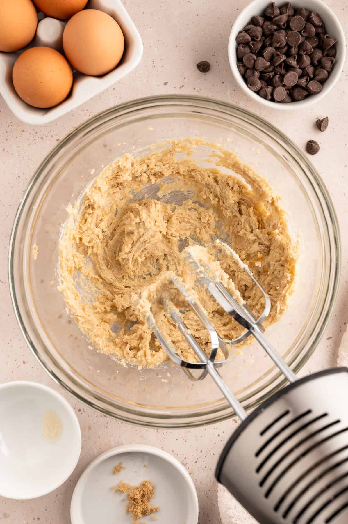 large mixing bowl with creamed butter and sugar. 