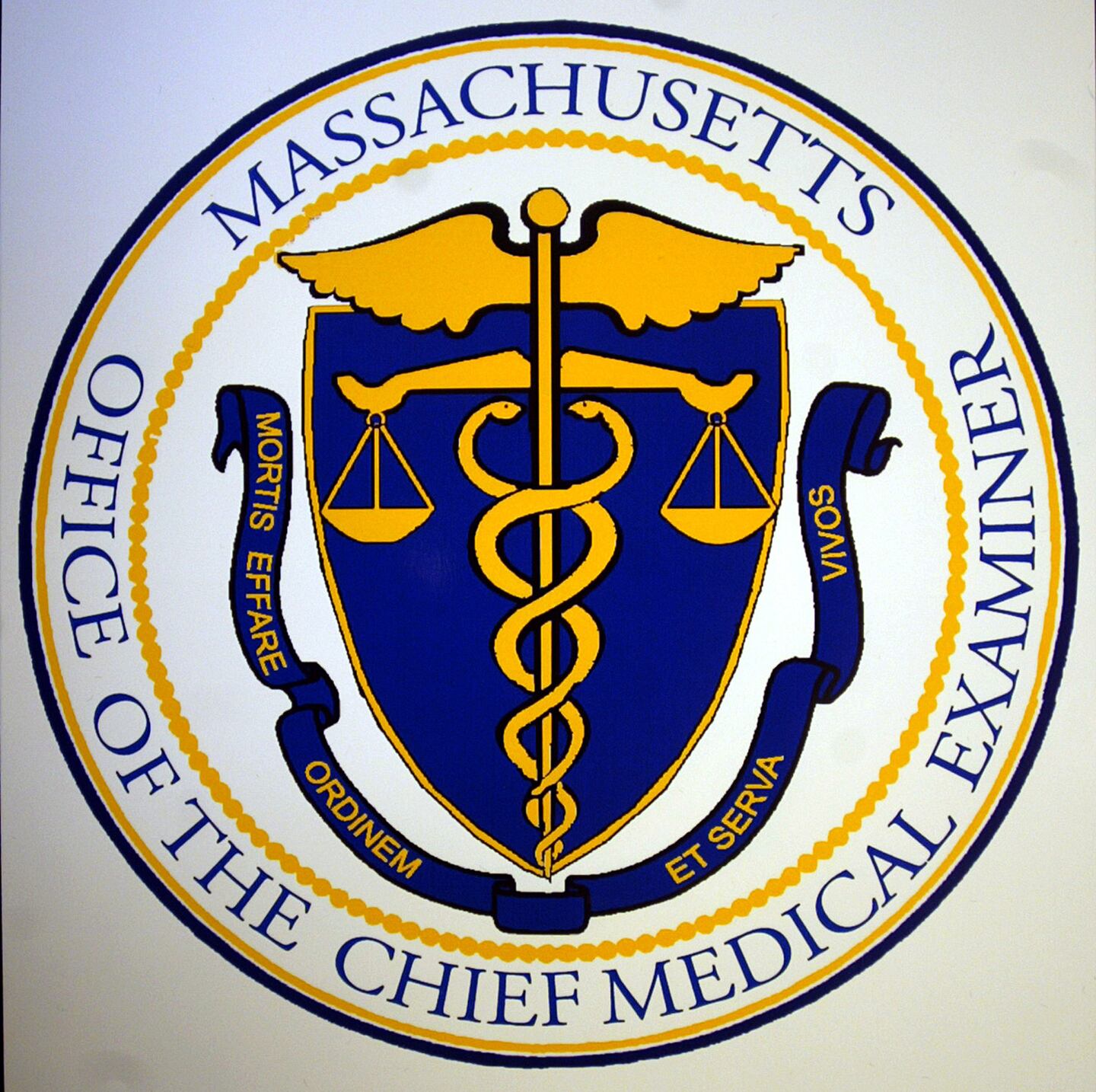 The seal of the Office of the Medical Examiner for Massachusetts.