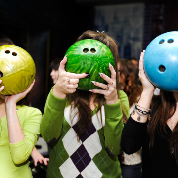 Three bowling balls showing the conventional drill 3 finger holes for bowling