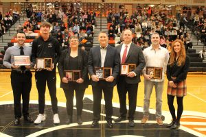 The Hall of Fame inductees and those representing some of the inductees at halftime of the boys basketball game on Friday, Dec. 13.