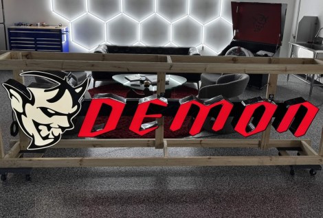 Illuminated Demon-Logo Sign