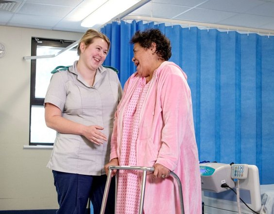 Apprentice Nurse with a patient on a ward