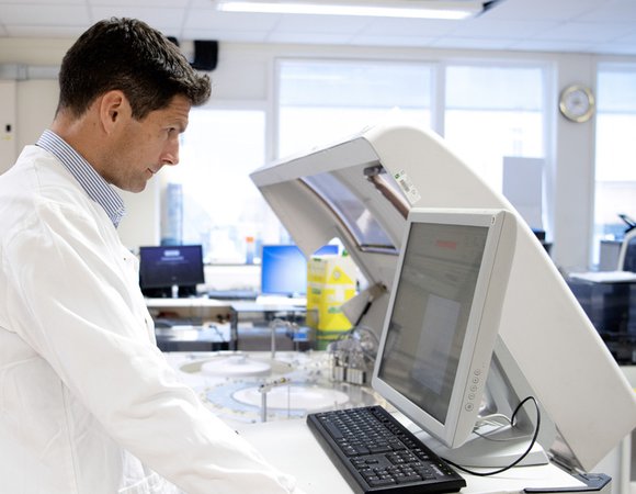 Researcher using computer in a research facility