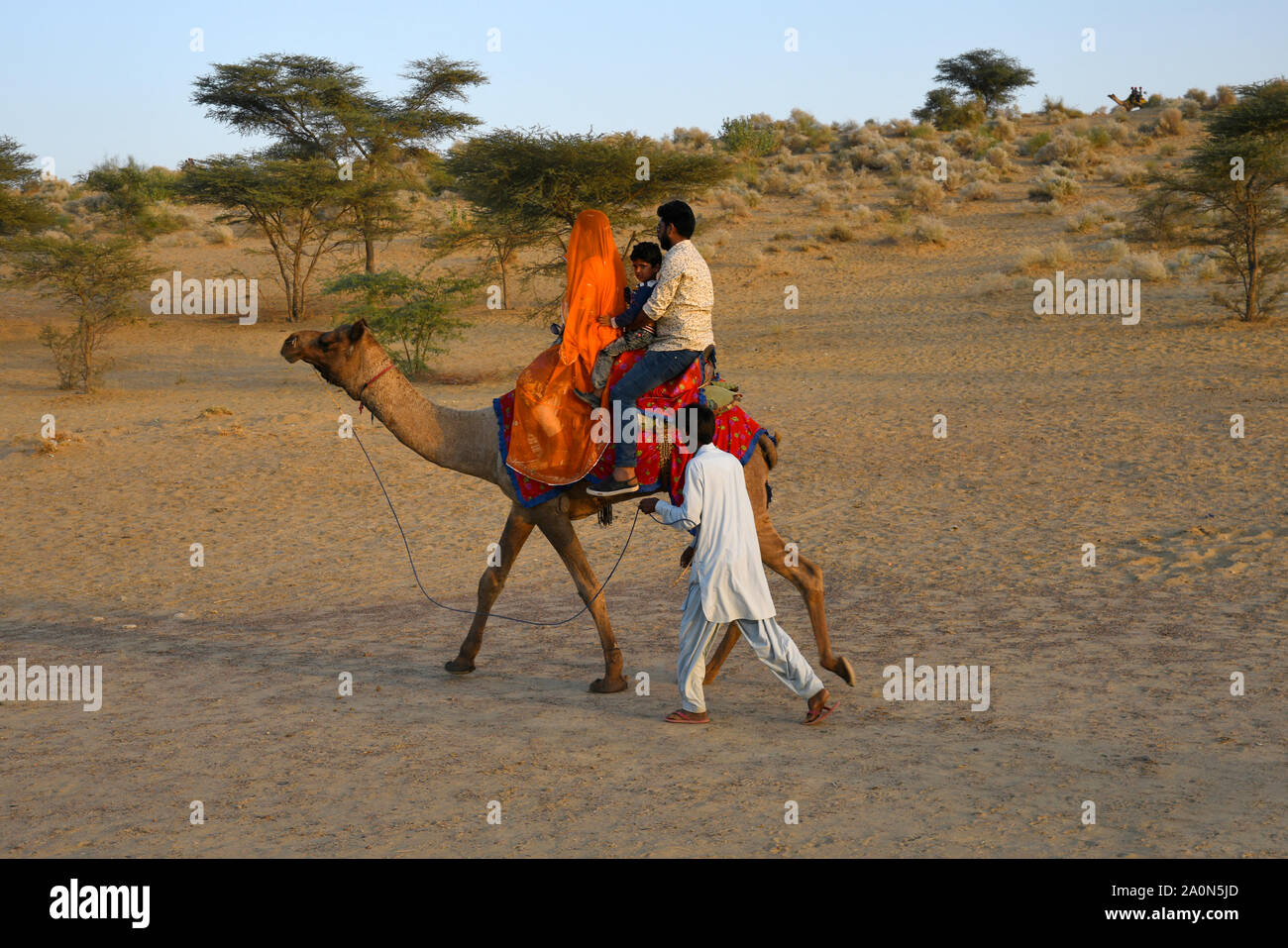 JAISALMER, RAJASTHAN, INDIA, November 2018, Tourist enoying camel rides at SAM dunes Stock Photo