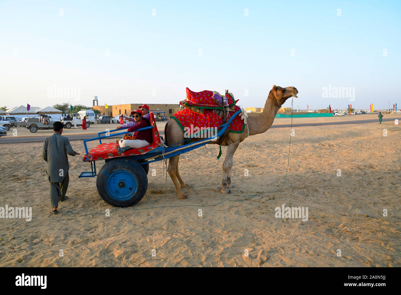 JAISALMER, RAJASTHAN, INDIA, November 2018, Tourist enoying Camel Cart rides at SAM dunes Stock Photo