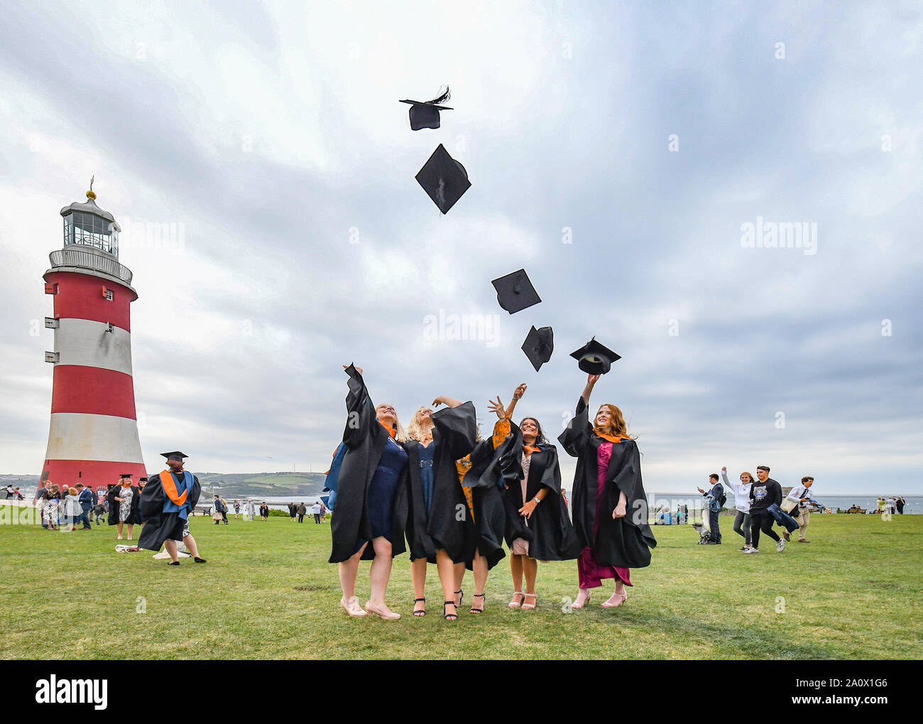 Plymouth, UK. 21st September 2019.  'Hats on the Hoe'. The next generation of Nurses graduation ceremony on Plymouth Hoe. Emma Renshaw, Emily Culm, Charlene Nairn, Tilly Trevillion and Maddie Watson all from the Cornwall campus of Plymouth University celebrating their graduation in the time honoured manner. Credit Simon Maycock / Alamy Live News. Stock Photo