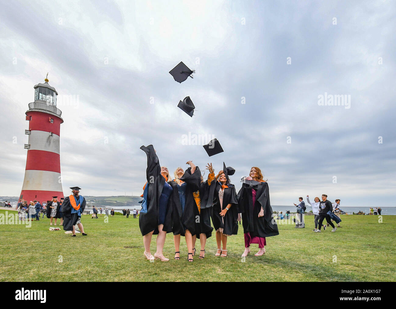 Plymouth, UK. 21st September 2019.  'Hats on the Hoe'. The next generation of Nurses graduation ceremony on Plymouth Hoe. Emma Renshaw, Emily Culm, Charlene Nairn, Tilly Trevillion and Maddie Watson all from the Cornwall campus of Plymouth University celebrating their graduation in the time honoured manner. Credit Simon Maycock / Alamy Live News. Stock Photo