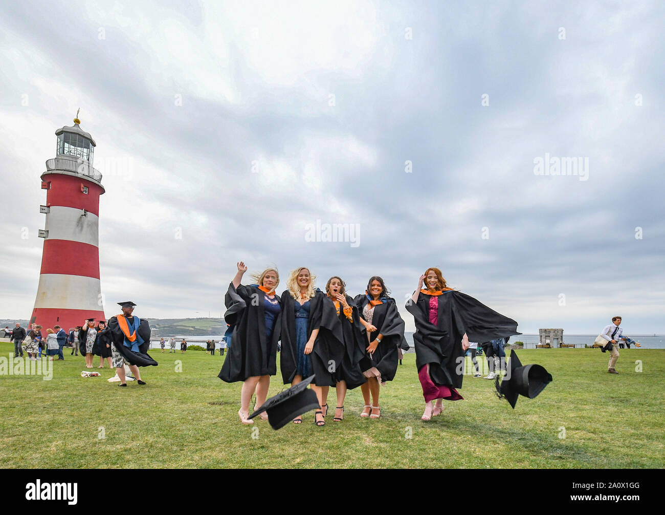 Plymouth, UK. 21st September 2019.  'Hats on the Hoe'. The next generation of Nurses graduation ceremony on Plymouth Hoe. Emma Renshaw, Emily Culm, Charlene Nairn, Tilly Trevillion and Maddie Watson all from the Cornwall campus of Plymouth University celebrating their graduation in the time honoured manner. Credit Simon Maycock / Alamy Live News. Stock Photo