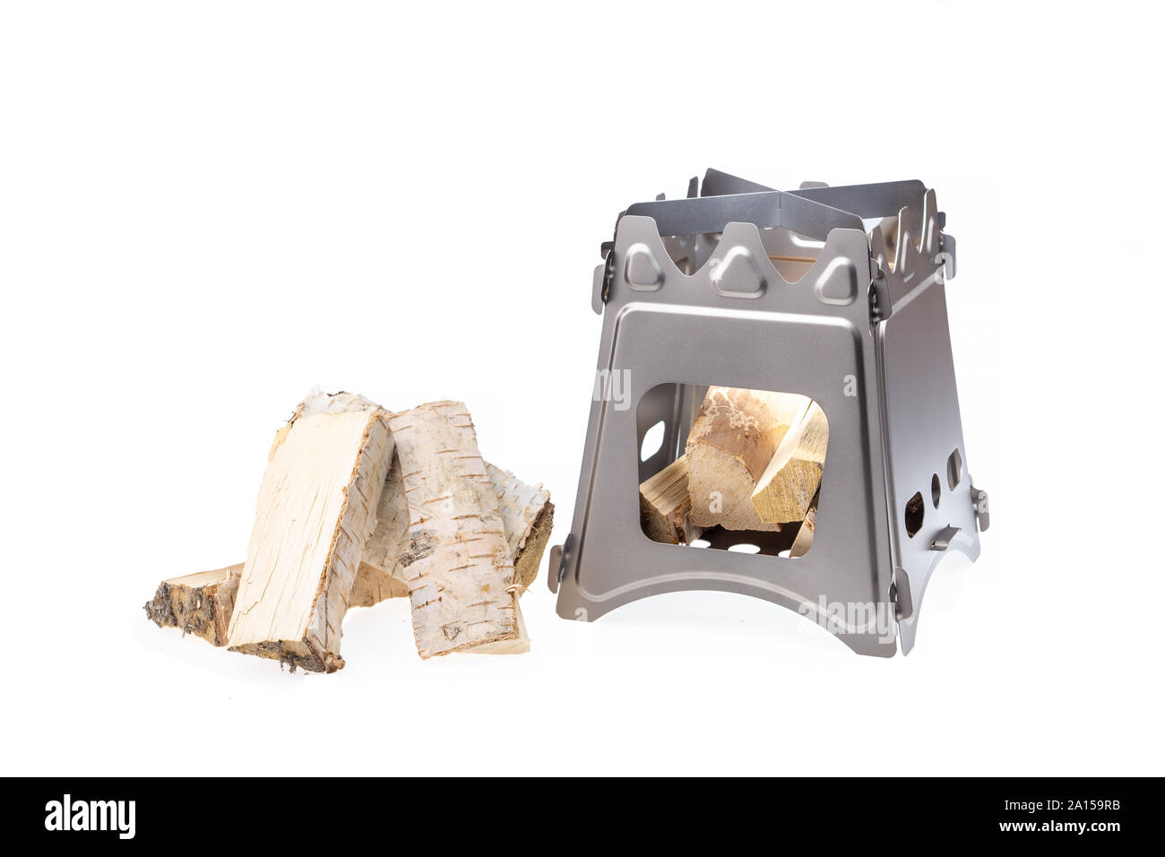 Folding wood stove designed for cooking outdoors using small firewood as fuel Stock Photo