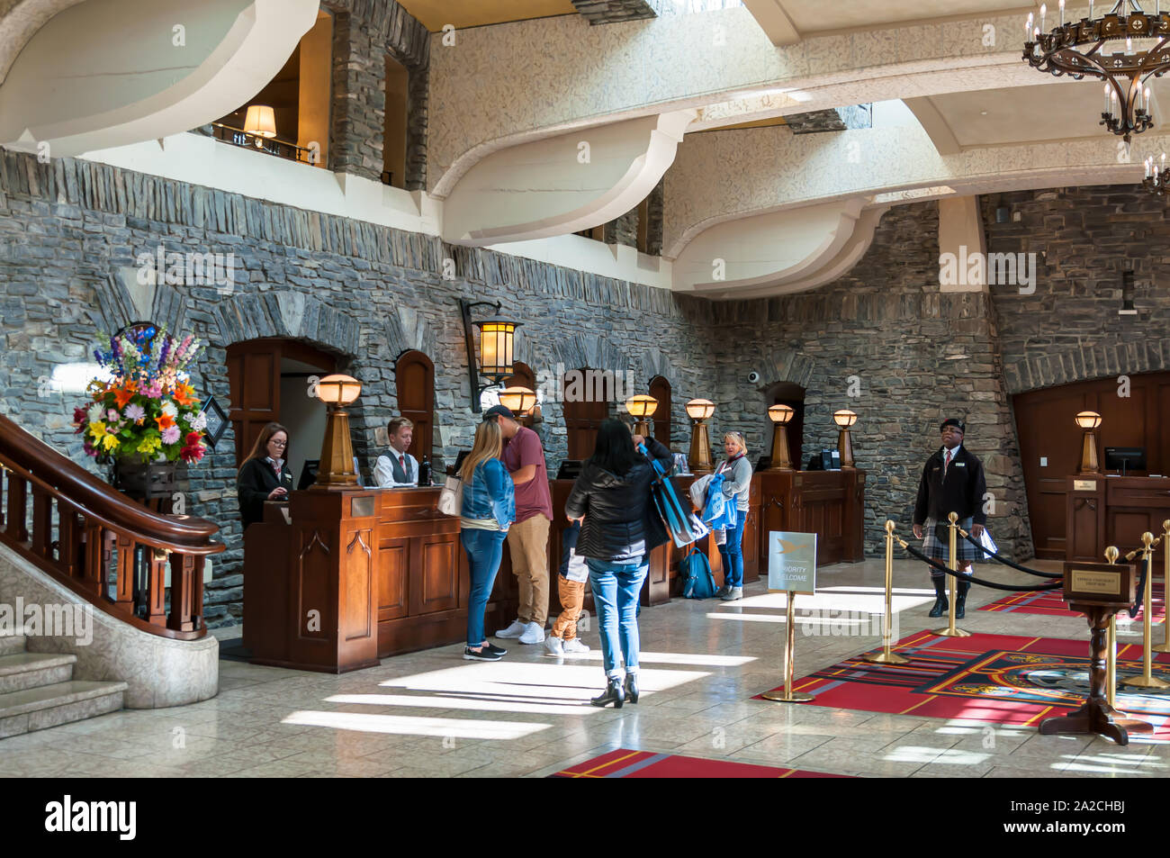 The Fairmont Banff Springs hotel lobby with guests checking into the hotel, Banff, Alberta, Canada Stock Photo