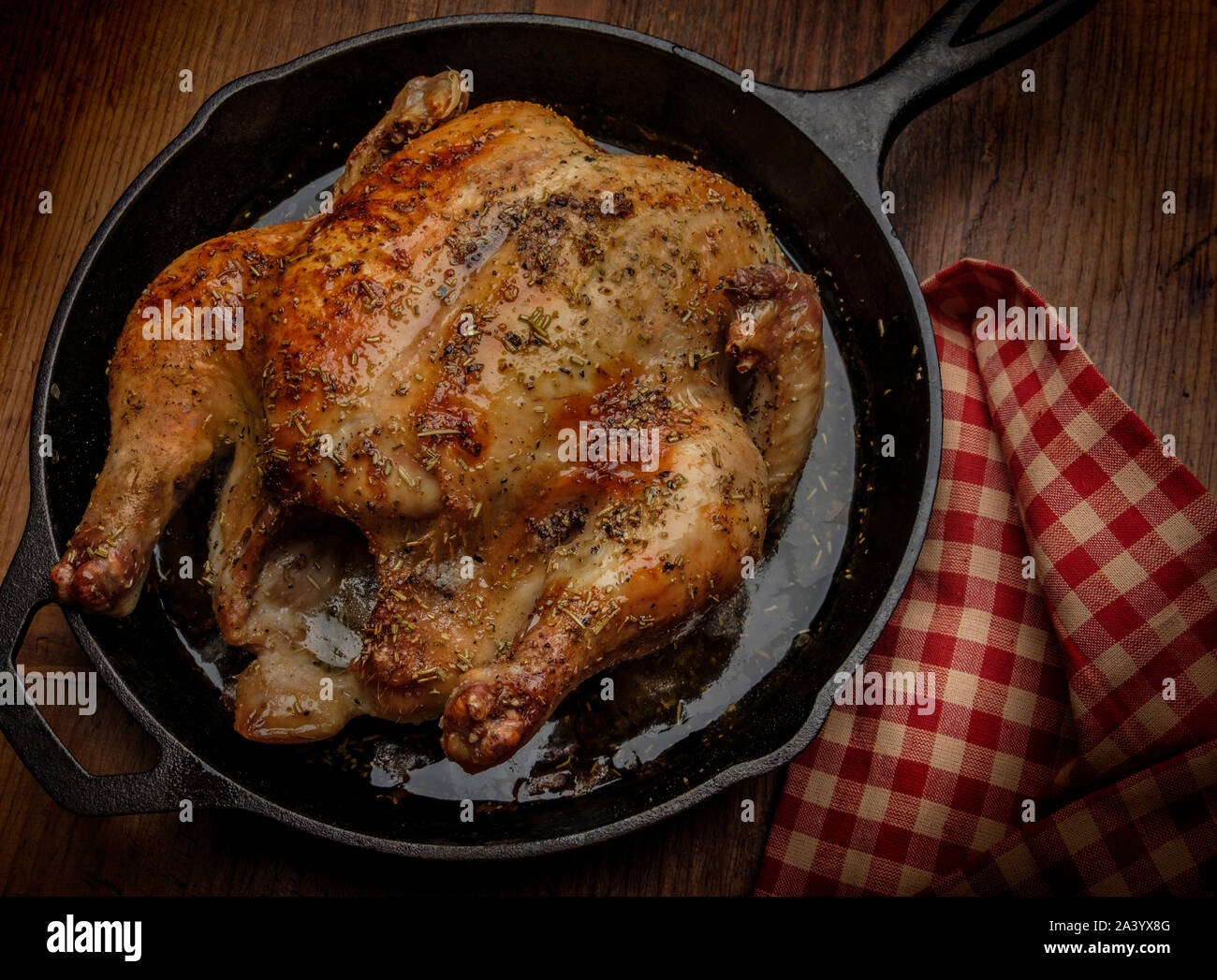 Roast chicken in frying pan Stock Photo