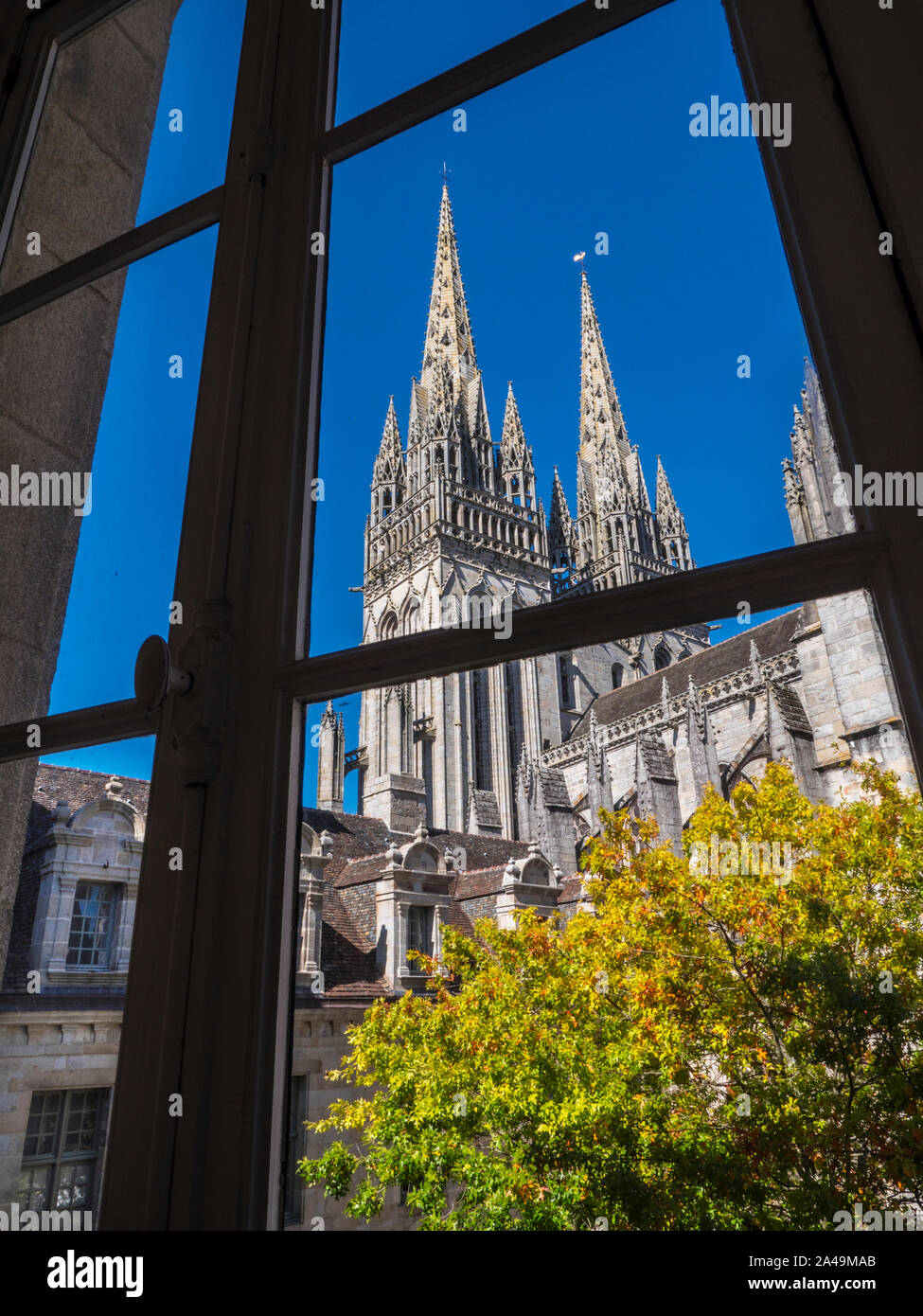 BRITTANY Quimper Cathedral, of Saint Corentin viewed through traditional French window, a Catholic cathedral & national monument of Brittany France Stock Photo