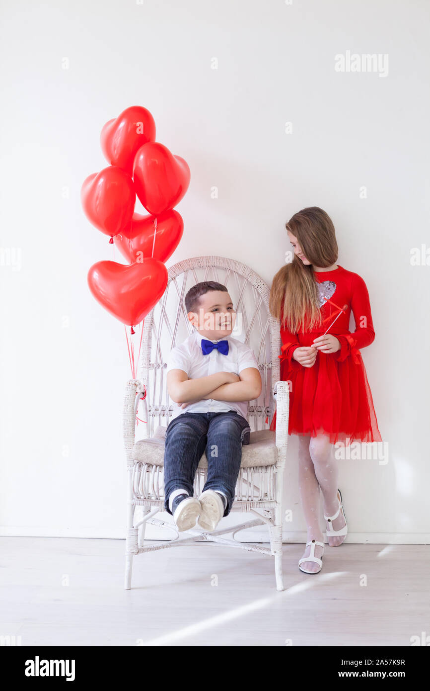 Girl and boy with balloons on Valentine's Day Stock Photo