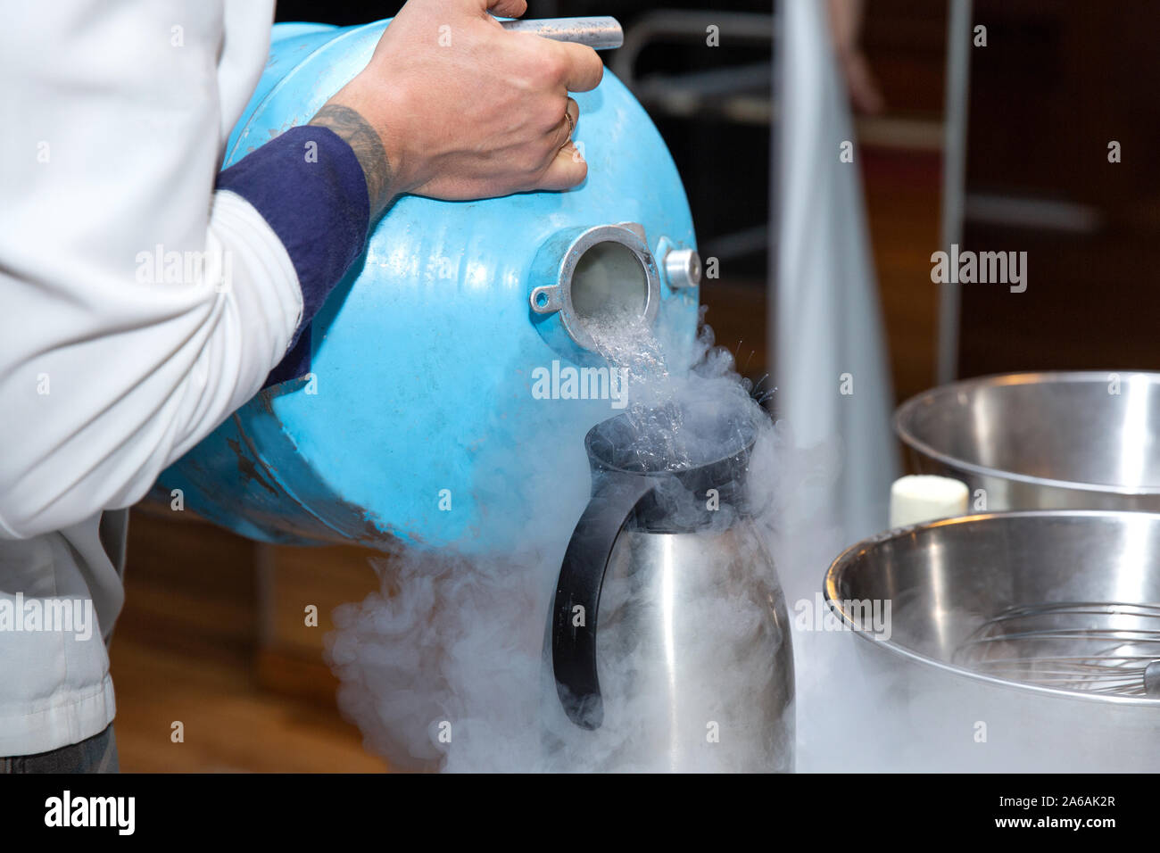 Chef is making ice cream with liquid nitrogen Stock Photo