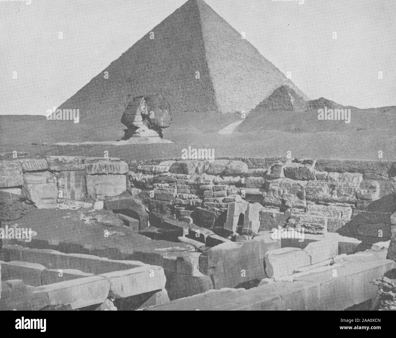 Black and white photograph of archaeological ruins near the Great Pyramid and the Great Sphinx of Giza in present-day El Giza, Egypt, by John Lawson Stoddard, published by Richard Peale and Co, 1892. From the New York Public Library. () Stock Photo