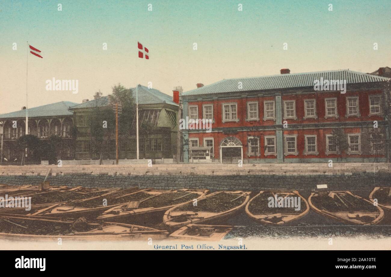 Illustrated postcard of the exterior view of the general post office with some barges in the foreground, Nagasaki, Japan, 1912. From the New York Public Library. () Stock Photo