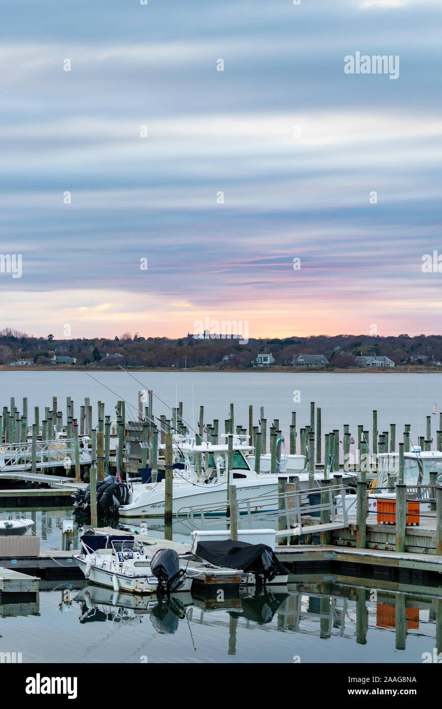 View of boats docked in marina at sunset Stock Photo