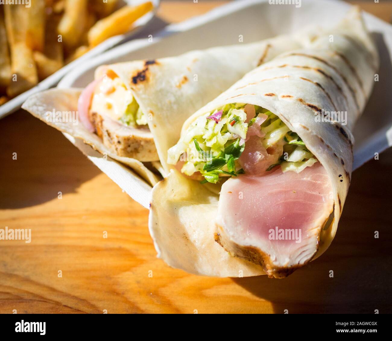 Hand-roll style albacore tuna tacos and chips from Red Fish Blue Fish Restaurant in Victoria, British Columbia, Canada. Stock Photo