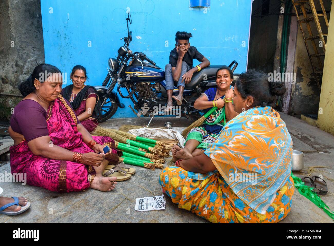 Indian women making brooms in Dharavi Slum at Mumbai. India Stock Photo