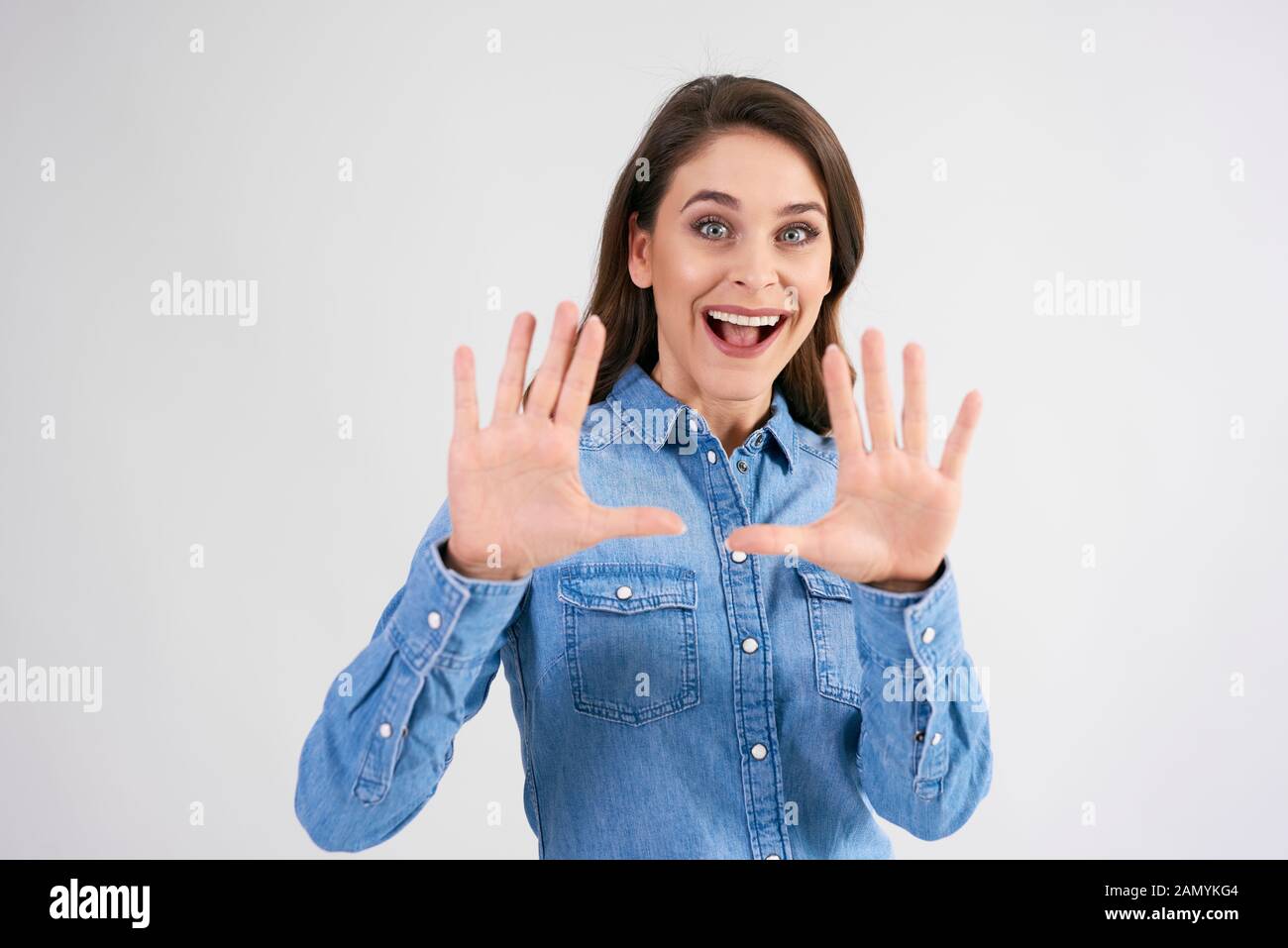 Female hands framing composition in studio shot Stock Photo