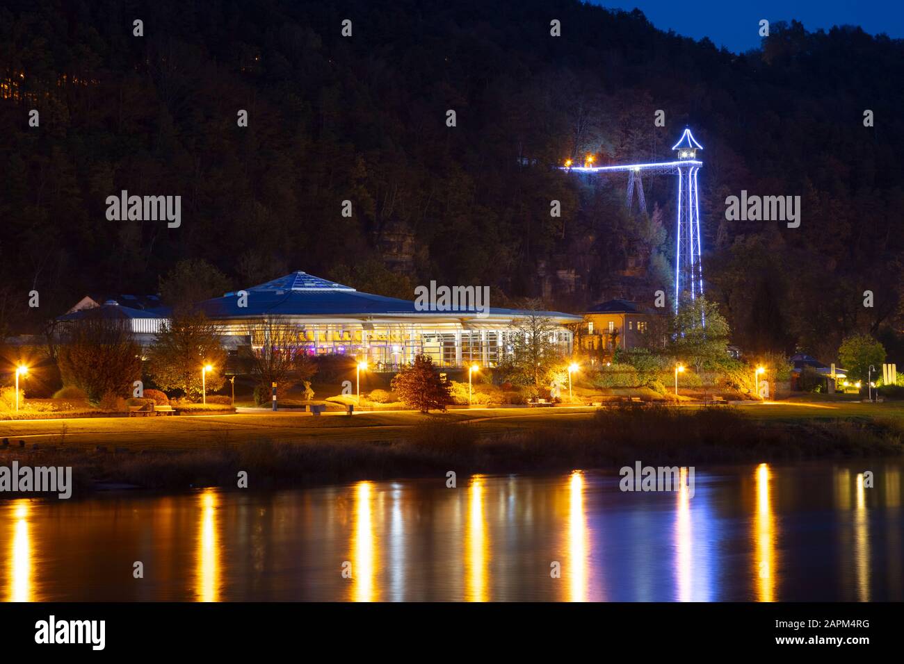 Germany, Saxony, Saxon Switzerland, Bad Schandau and river Elbe at night, Toskana Therme, historical passenger elevator Stock Photo